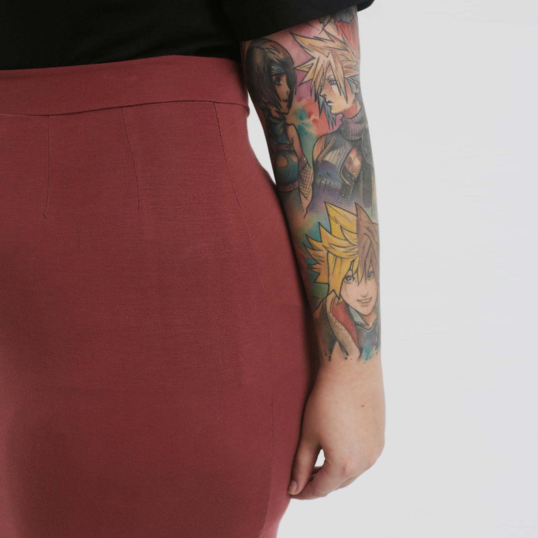 High-waisted pencil skirt from The Shapes United, showcasing a fitted clothing style in a sleek, stylish silhouette.