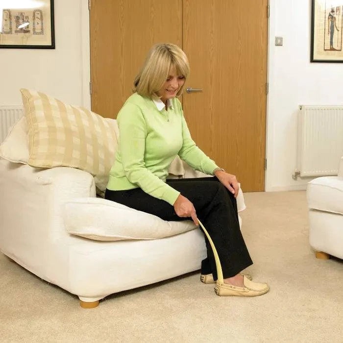 Performance Health Homecraft plastic shoehorn, a durable footwear accessory with a curved design for easy shoe wearing.