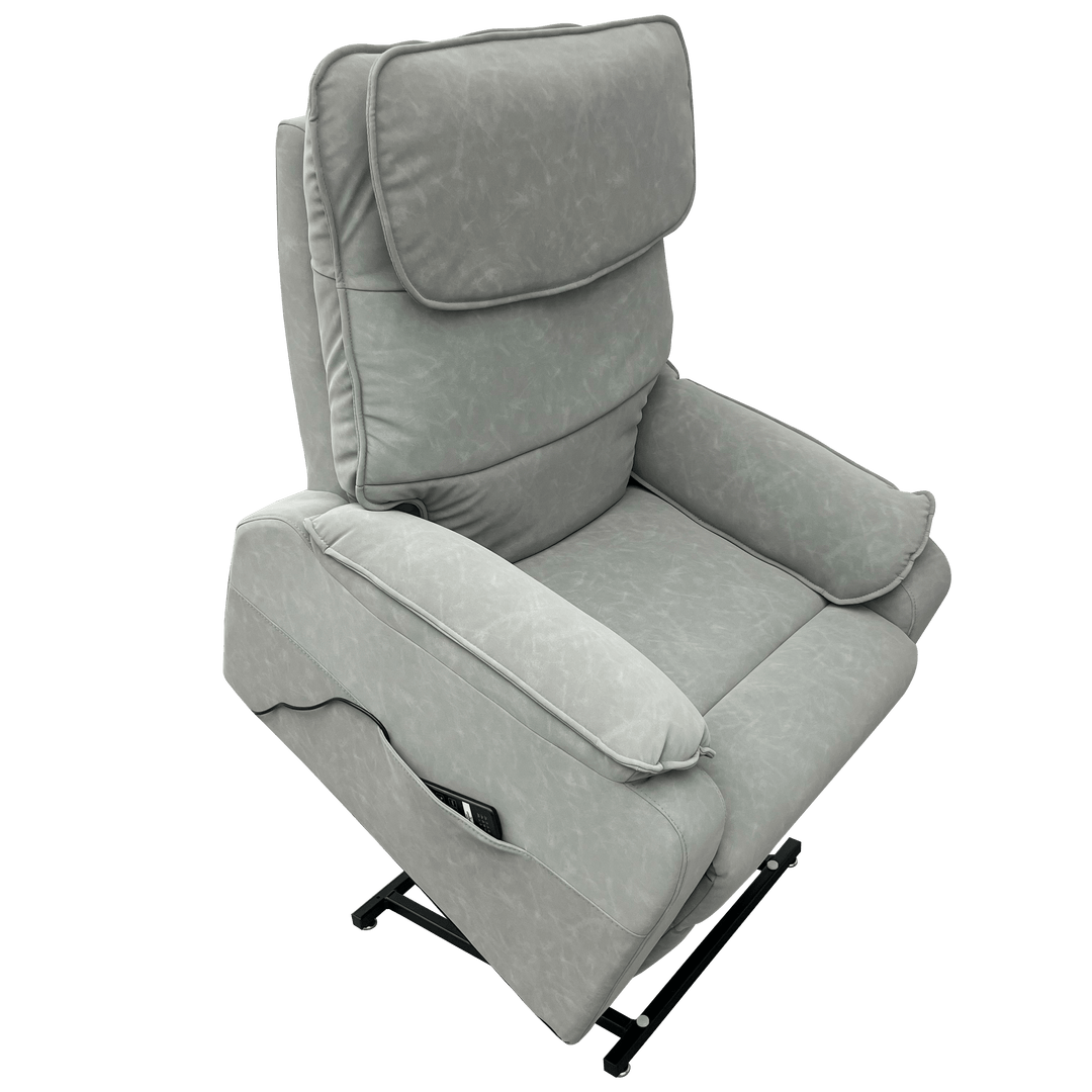 Pinnacle ComfortCare Zen massage lift recliner in plush fabric with padded armrests and built-in control panel for relaxation.