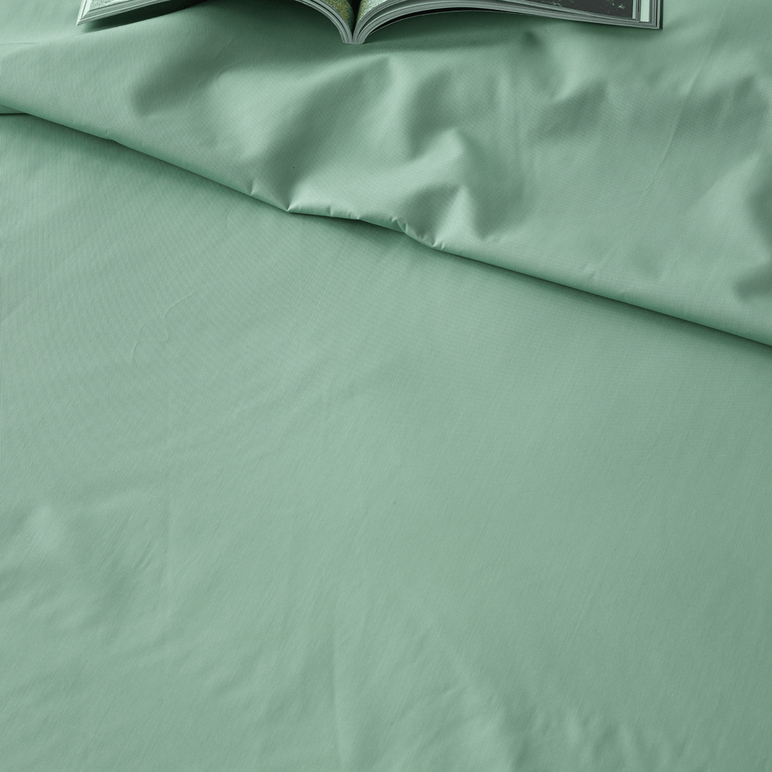 Staydry Bamboo waterproof sheet set on a bed, showcasing soft, breathable bamboo fabric, and secure fit for comfortable sleep.