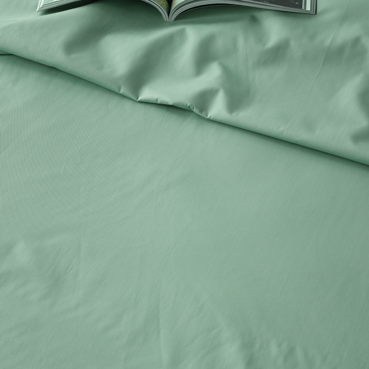 Staydry Bamboo waterproof sheet set on a bed, showcasing soft, breathable bamboo fabric, and secure fit for comfortable sleep.