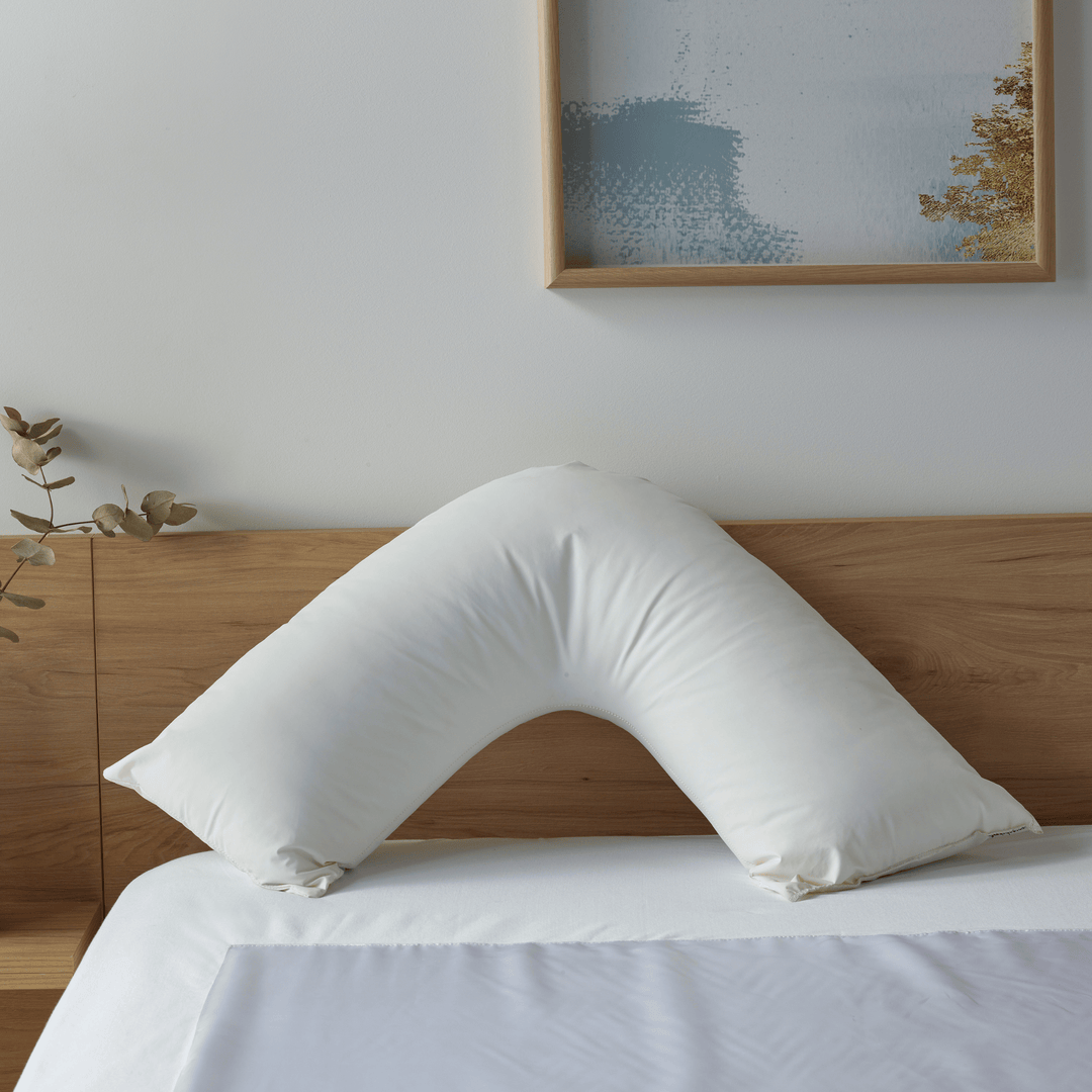 Staydry Duratherme waterproof Manchester boomerang pillow with soft fabric and supportive shape for comfortable sleep.