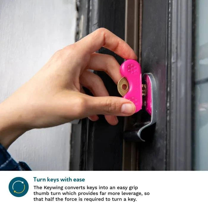 Two pink Dext Keywing Key Turner arthritis aids in a 3-pack, designed to help grip and turn keys easily for improved accessibility.