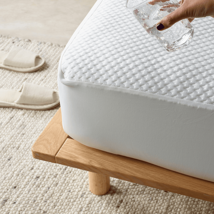 Staydry Duradeluxe waterproof mattress protector on a bed, showing its soft, fitted Manchester style fabric by Stay Dry Products.