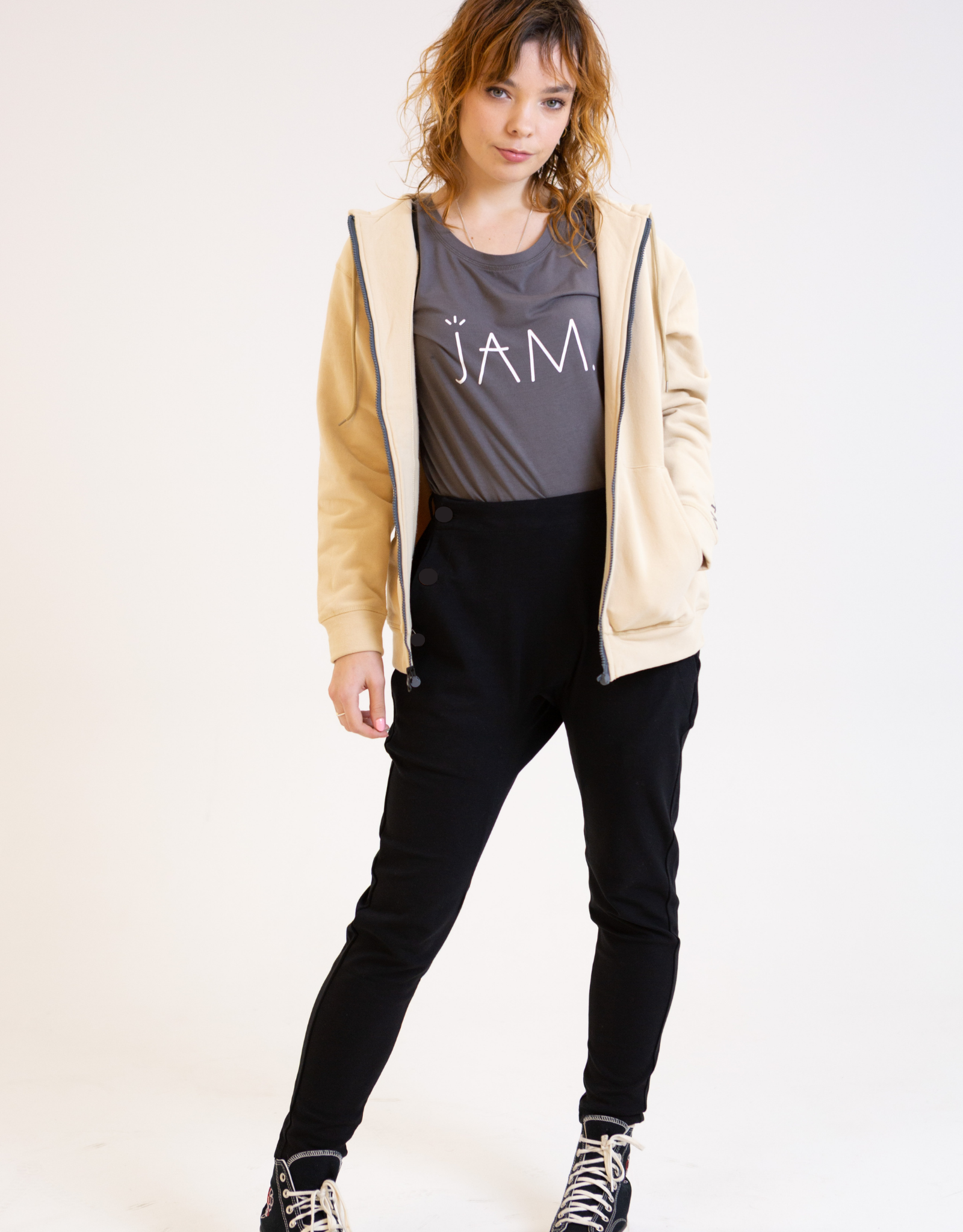 High-waisted pants from JAM the Label featuring a sleek design and comfortable fit, displayed in a stylish setting.