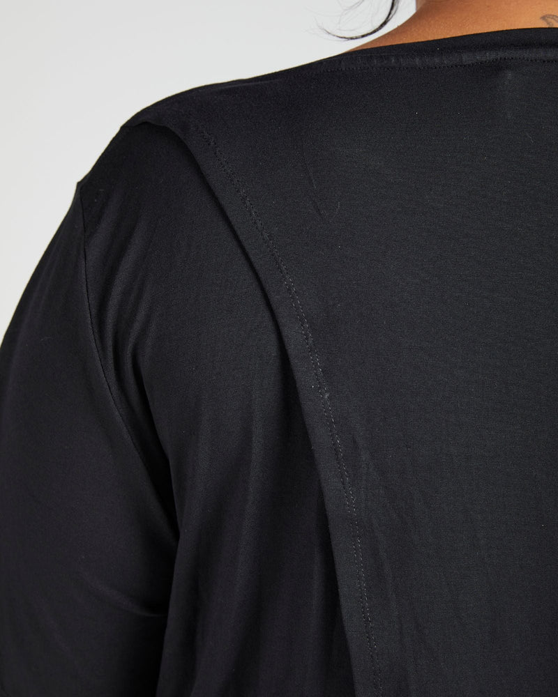 Close-up detail of the Lilli Leaf Back T-Shirt showing the smooth black fabric texture and precise shoulder seam construction, highlighting the quality StainFree adaptive material and sophisticated design elements of this essential wardrobe piece.