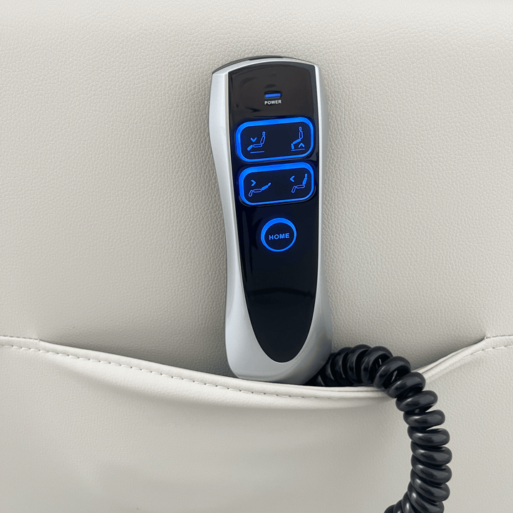 Pinnacle ComfortCare Zen massage lift recliner in soft beige fabric with padded armrests and built-in massage controls.
