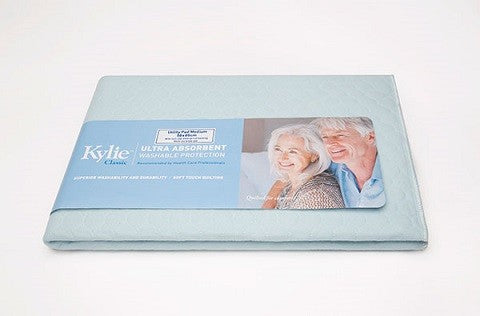 A folded light blue Kylie Classic Ultra Absorbent Overnight Protection sheet set, shown with its original packaging label on a white background.