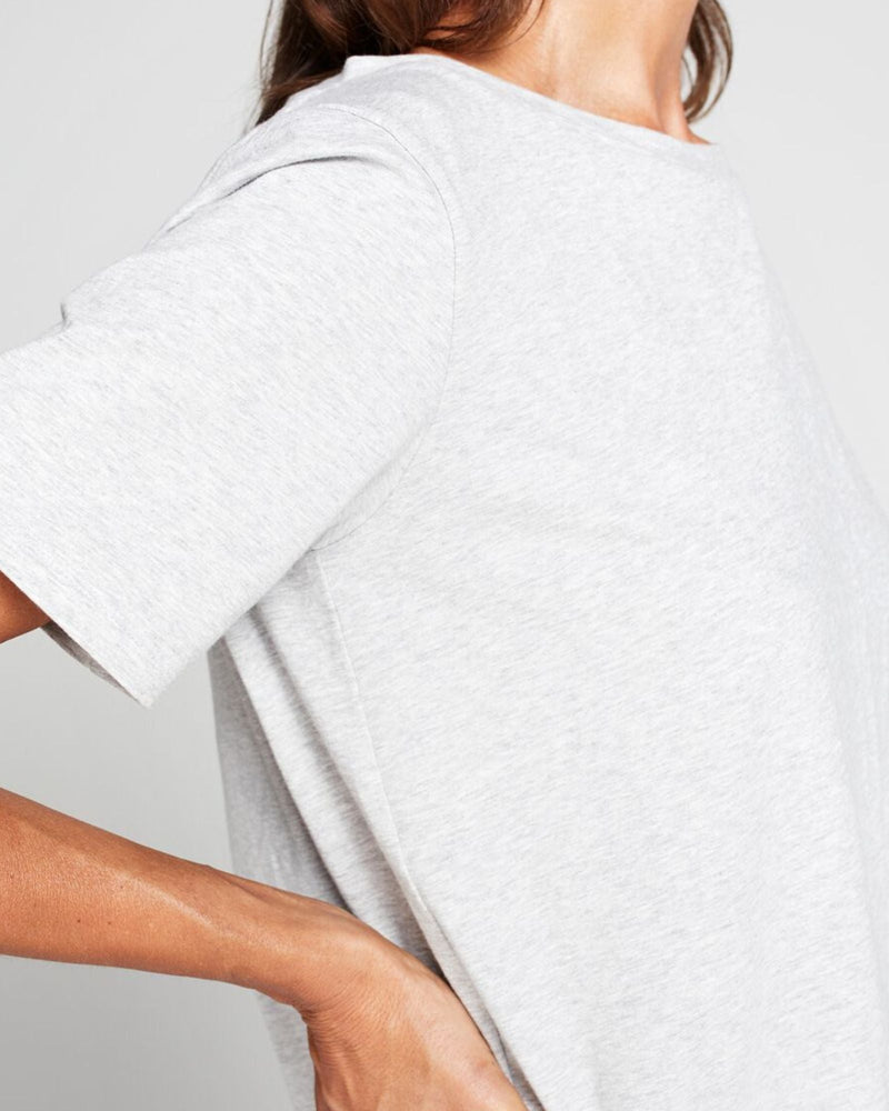 Lilli Leaf Back T-Shirt shown from side angle, displaying light heather gray fabric with short sleeves. Close-up view highlights the soft, textured material and casual fit of this adaptive essential featuring StainFree technology and modern design details.