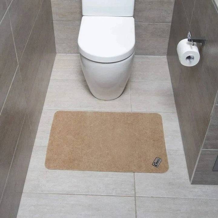Conni Compact Pebble Manchester floor mat featuring a soft, textured pebble design in neutral tones, ideal for home entryways.