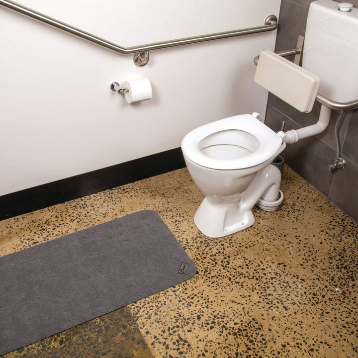 Conni anti-slip absorbent floor mat mid runner in Manchester style, designed for secure and comfortable flooring.