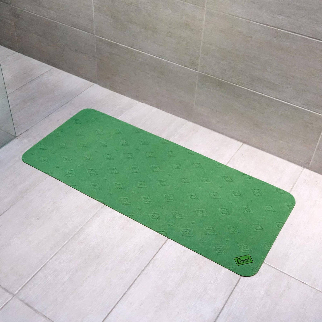 Green Conni anti-slip absorbent floor mat, mid runner style, Manchester design, with textured surface and non-slip backing.