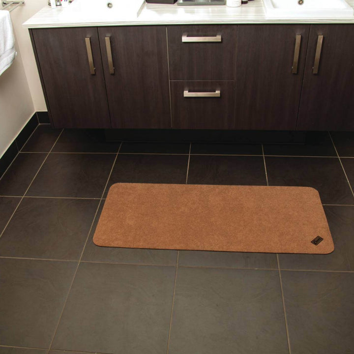 Conni anti-slip and absorbent Manchester floor mat, mid runner style with textured surface for safety and comfort.