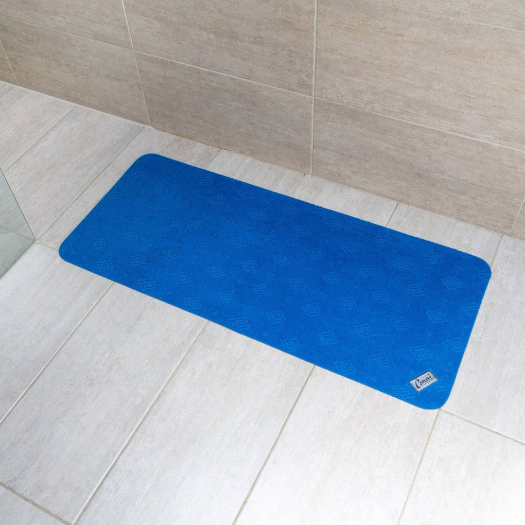 Royal blue Conni anti-slip absorbent floor mat, mid runner style in Manchester, with non-slip backing and soft, absorbent surface.