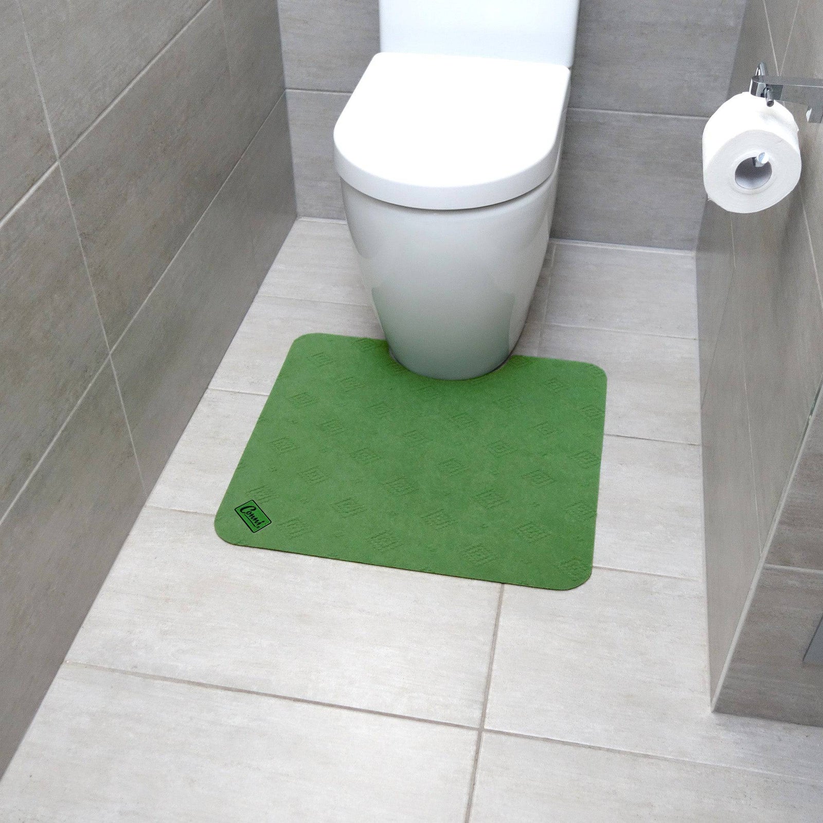 Green Conni Manchester toilet floor mat with non-slip backing, designed for bathroom comfort and safety.