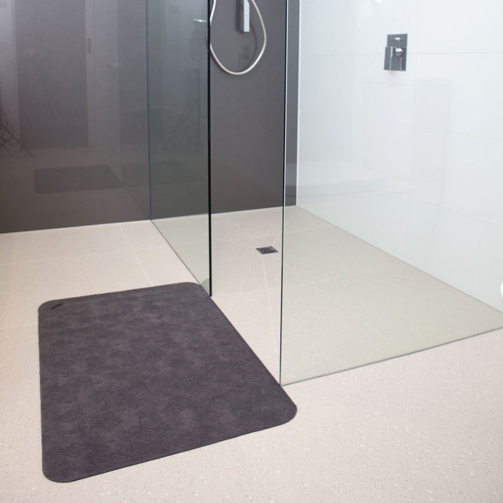 Conni classic grey anti-slip and absorbent Manchester floor mat with textured surface for safety and comfort.