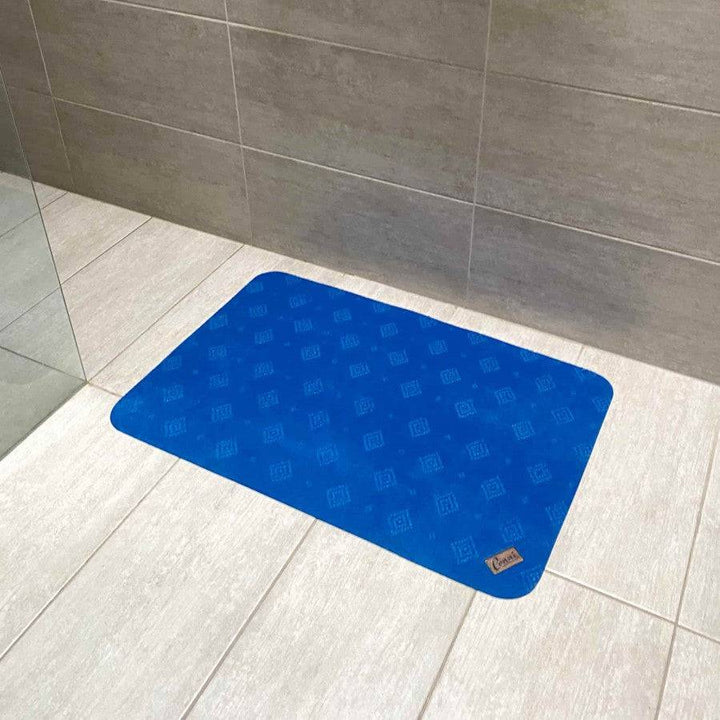 Royal blue Conni anti-slip absorbent floor mat, classic design, featuring textured surface and non-slip backing for safety.