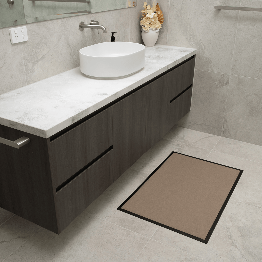 Beige Staydry absorbent floor mat from Manchester, designed for moisture absorption and floor protection.