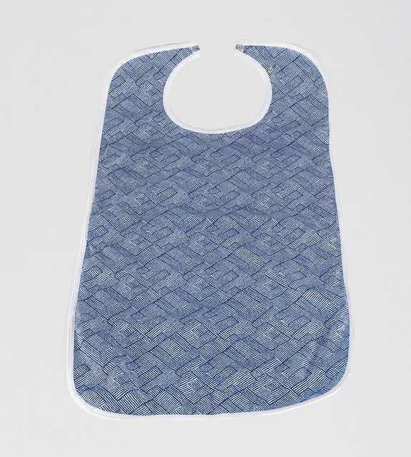 Blue geometric Brolly Sheets feeding bib for adaptive clothing, designed to protect clothing during feeding.