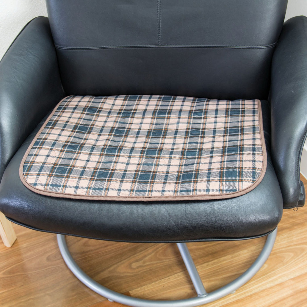 Small Conni chair pad in tartan pattern, designed for added comfort in Manchester-style seating.