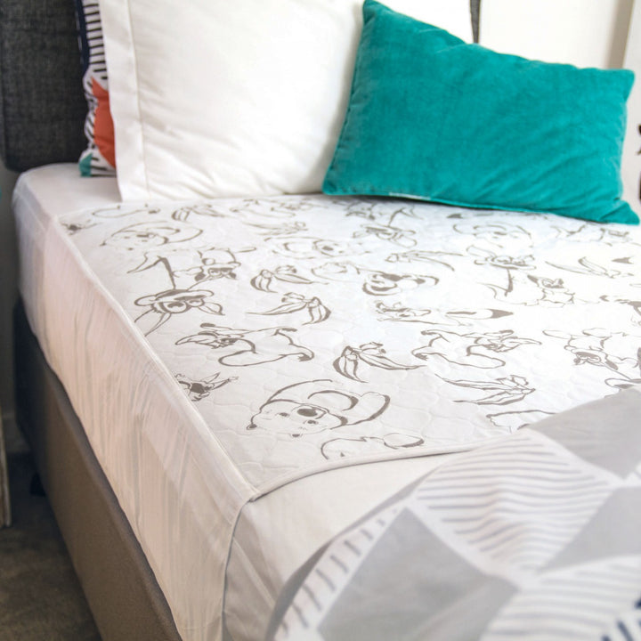 Conni Kids Bed Pad with tuck-ins featuring Aussie Animals design, ideal for children's bedding needs.
