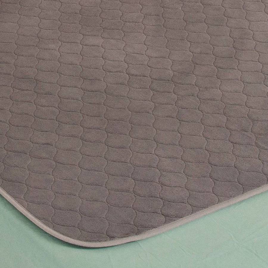Conni plush top Manchester bed pad with soft, cushioned surface, designed for comfort and protection in the bedroom.