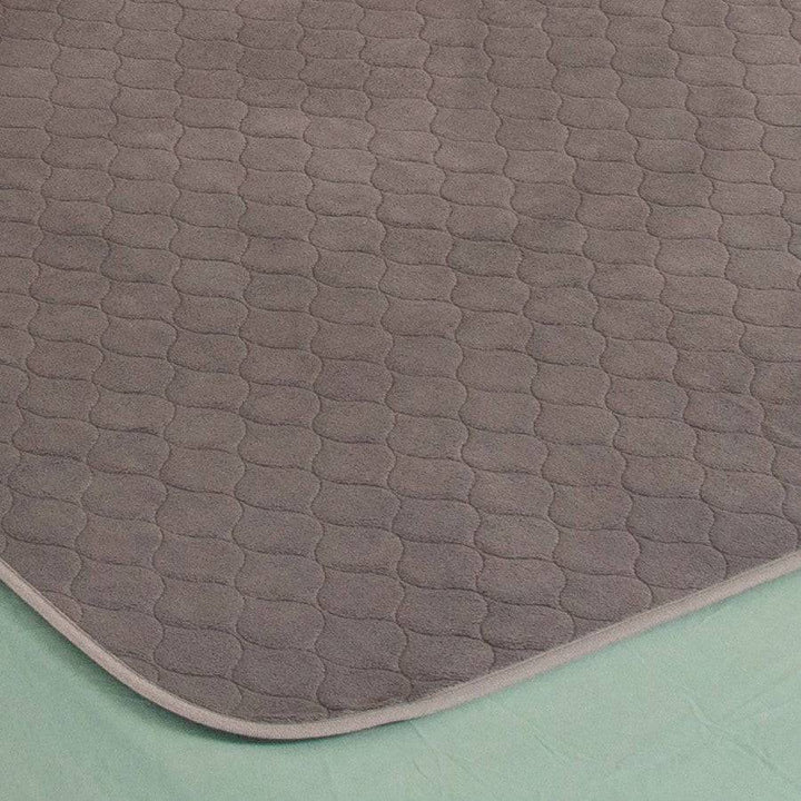 Conni plush top Manchester bed pad with soft, cushioned surface, designed for comfort and protection in the bedroom.