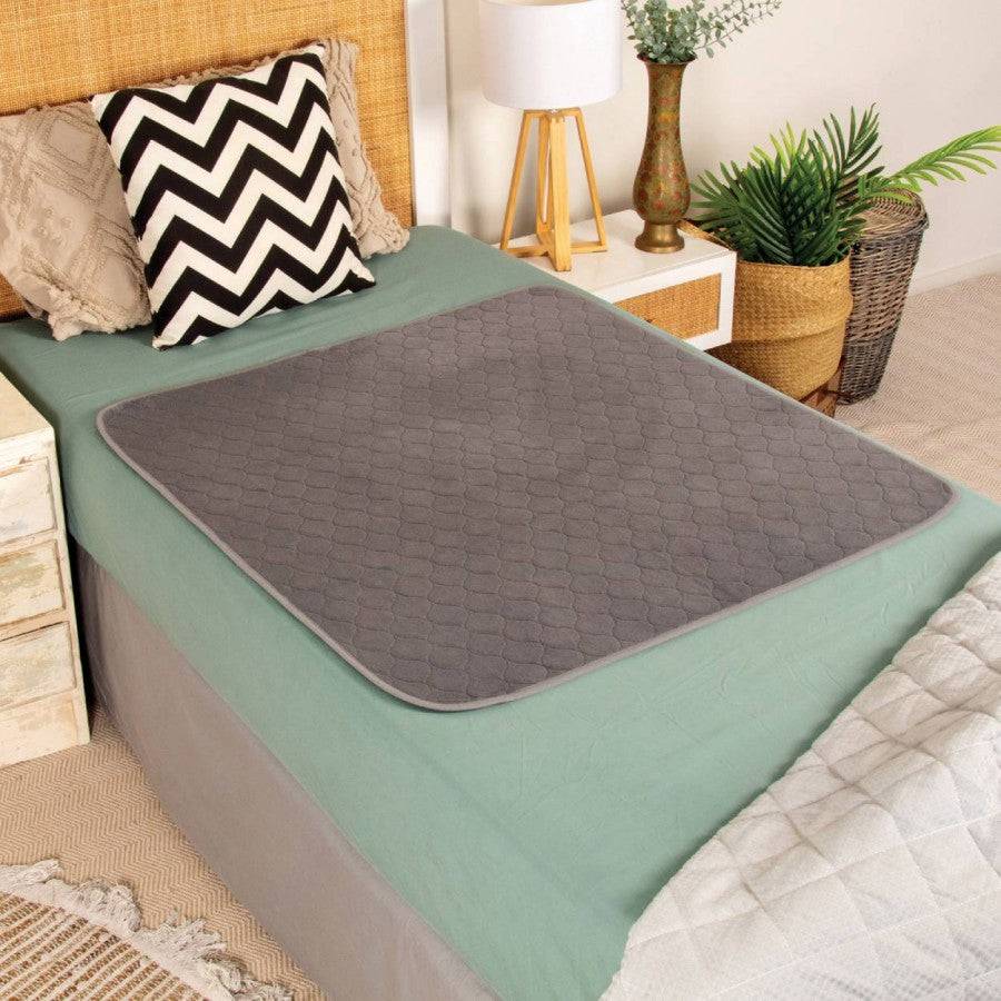 Conni plush top bed pad made of Manchester fabric, soft and comfortable bedding accessory for a cozy sleep environment.