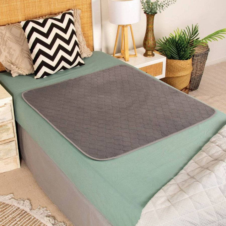 Conni plush top bed pad made of Manchester fabric, soft and comfortable bedding accessory for a cozy sleep environment.