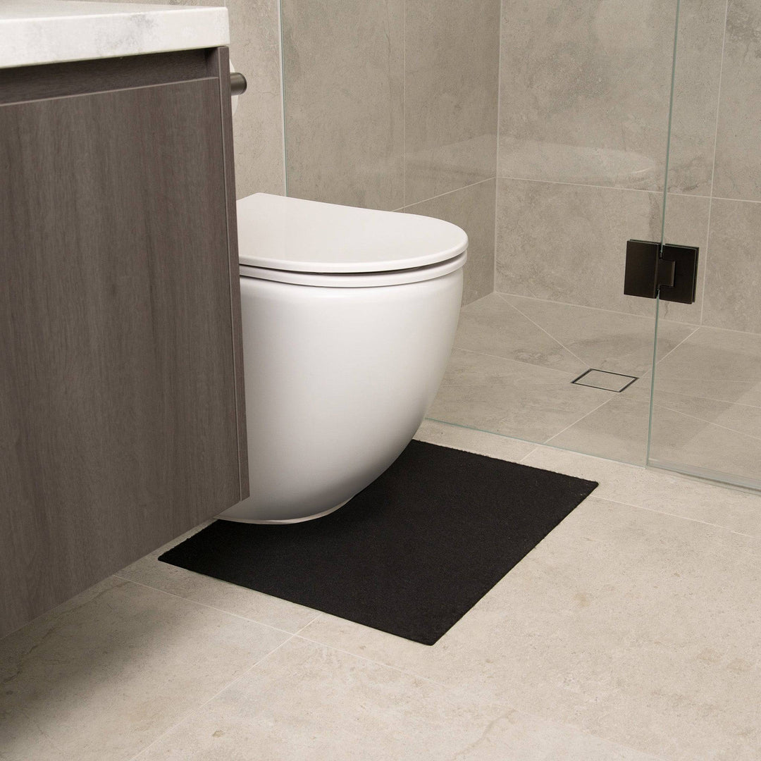 Black Staydry Low Profile Toilet Mat by Stay Dry Products, Manchester style, with a sleek, thin design for bathroom comfort.