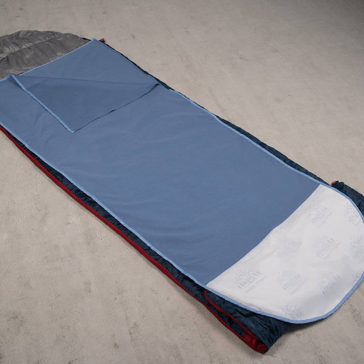 Staydry Waterproof Sleeping Bag Insert in blue, showcasing its durable material and cozy design for outdoor adventures.