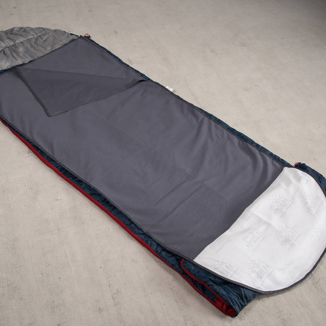 Grey Staydry waterproof sleeping bag insert displayed on a flat surface, showcasing its durable material and design.