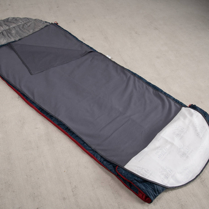 Grey Staydry waterproof sleeping bag insert displayed on a flat surface, showcasing its durable material and design.
