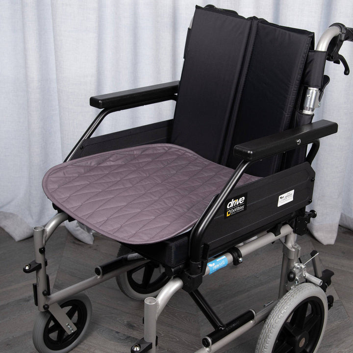 Gray Manchester Staydry wheelchair chair pad by Stay Dry Products with cushioned support and breathable fabric.
