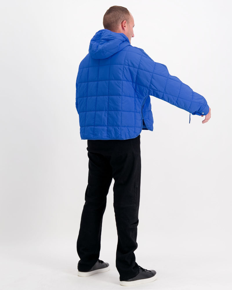 Standing male is wearing a cobolt blue puffer jacket over black pants. Christina Stephens Adaptive Clothing Australia.