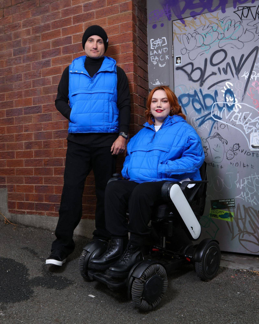 Blue adaptive puffer jacket by Christina Stephens designed for wheelchair users, showcasing a comfortable and functional fit.