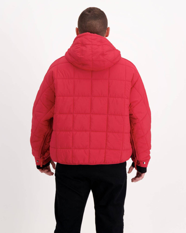 Red Elly Universal Adaptive Puffer Jacket by Christina Stephens, designed for wheelchair users with a cozy, functional fit.