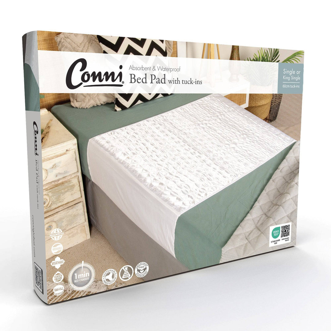 Conni Satin-Glide Manchester bed pad with tuck-ins, white color, designed for secure and comfortable bedding.