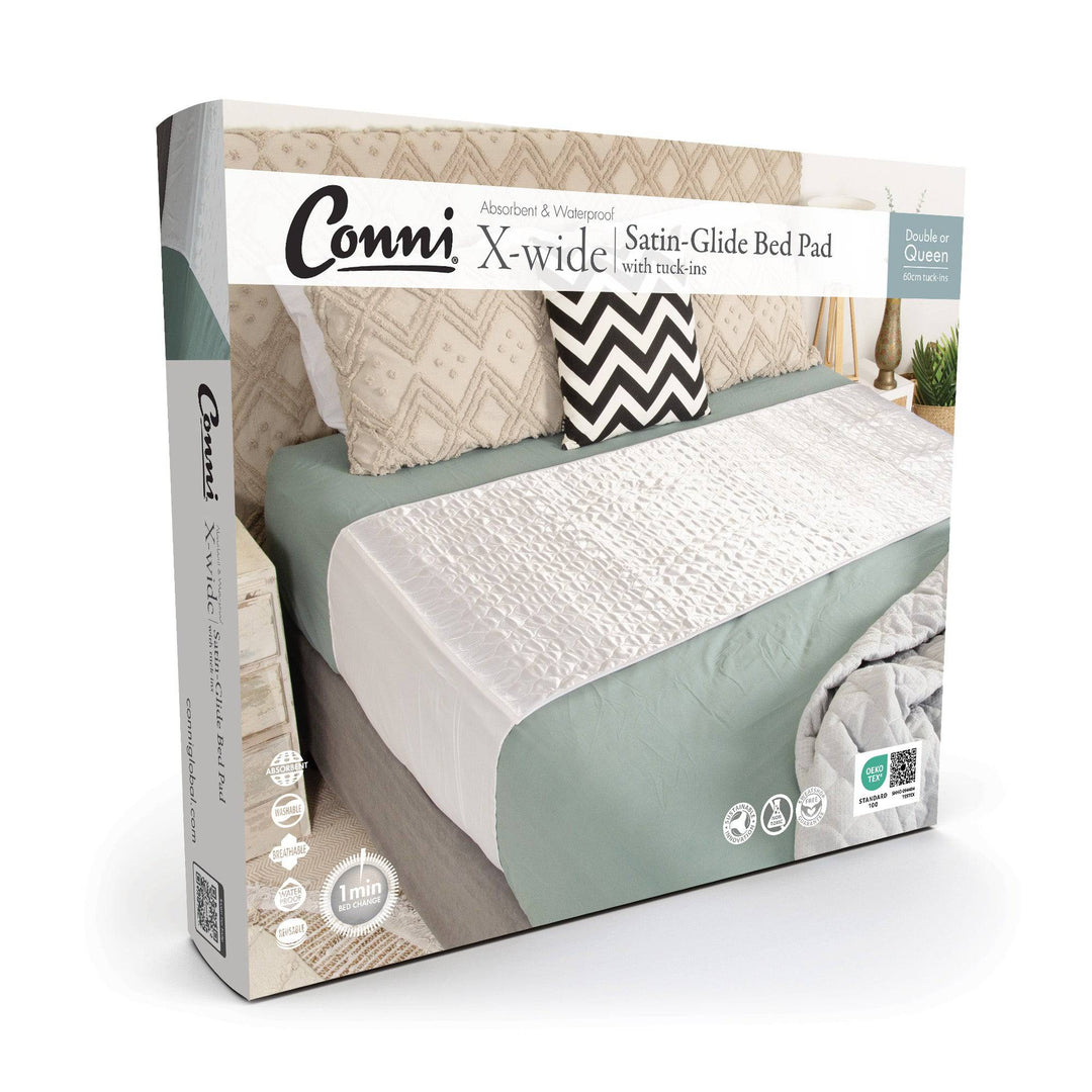 Conni Satin-Glide X-wide Manchester bed pad with tuck-ins, white fabric and extra-large size for comfortable protection.
