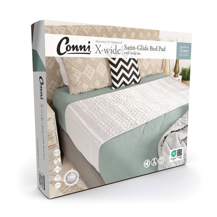 Conni Satin-Glide X-wide Manchester bed pad with tuck-ins, white fabric and extra-large size for comfortable protection.