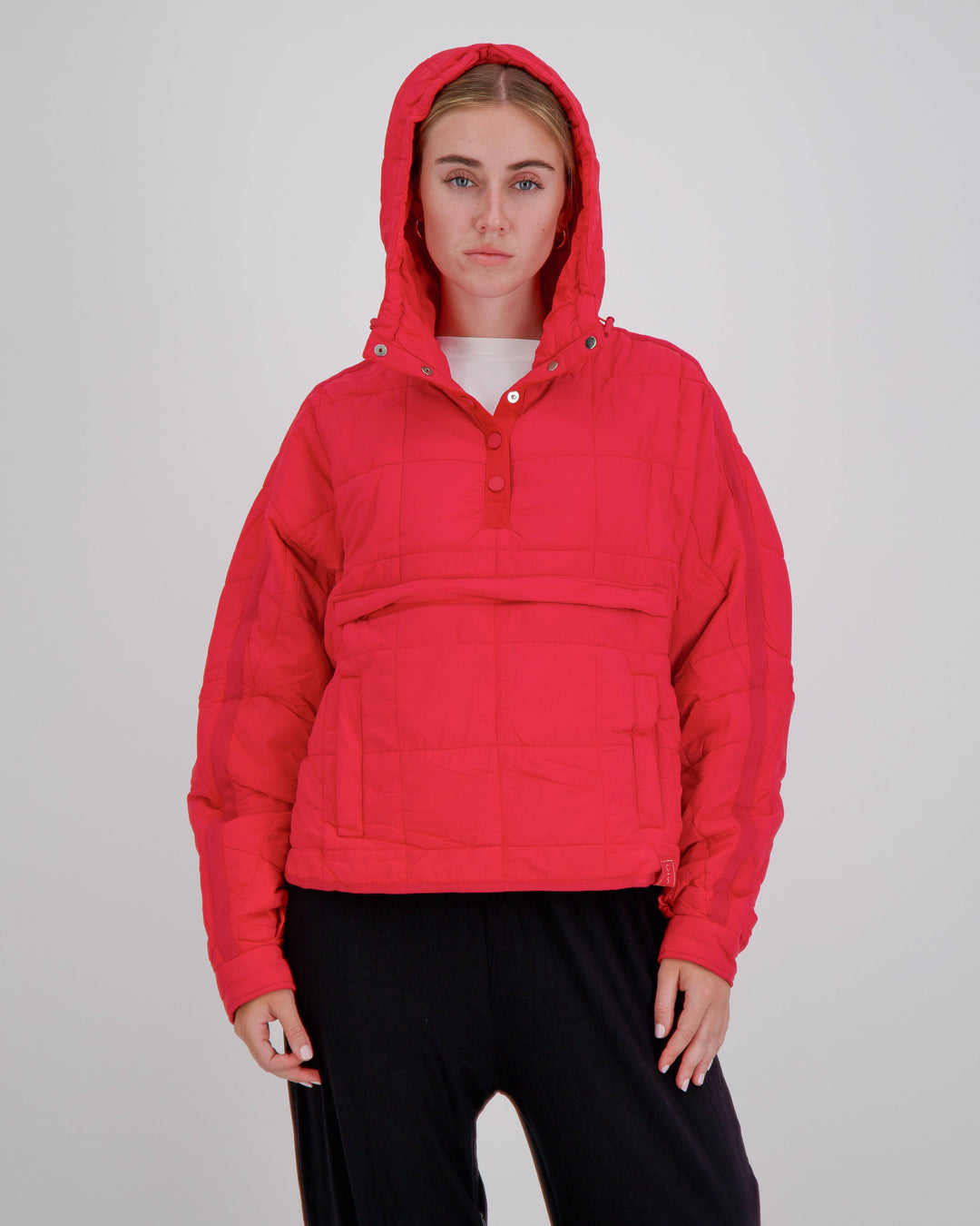 Red Elly Universal Adaptive Puffer Jacket by Christina Stephens, designed for wheelchair users with a cozy fit and functional style.