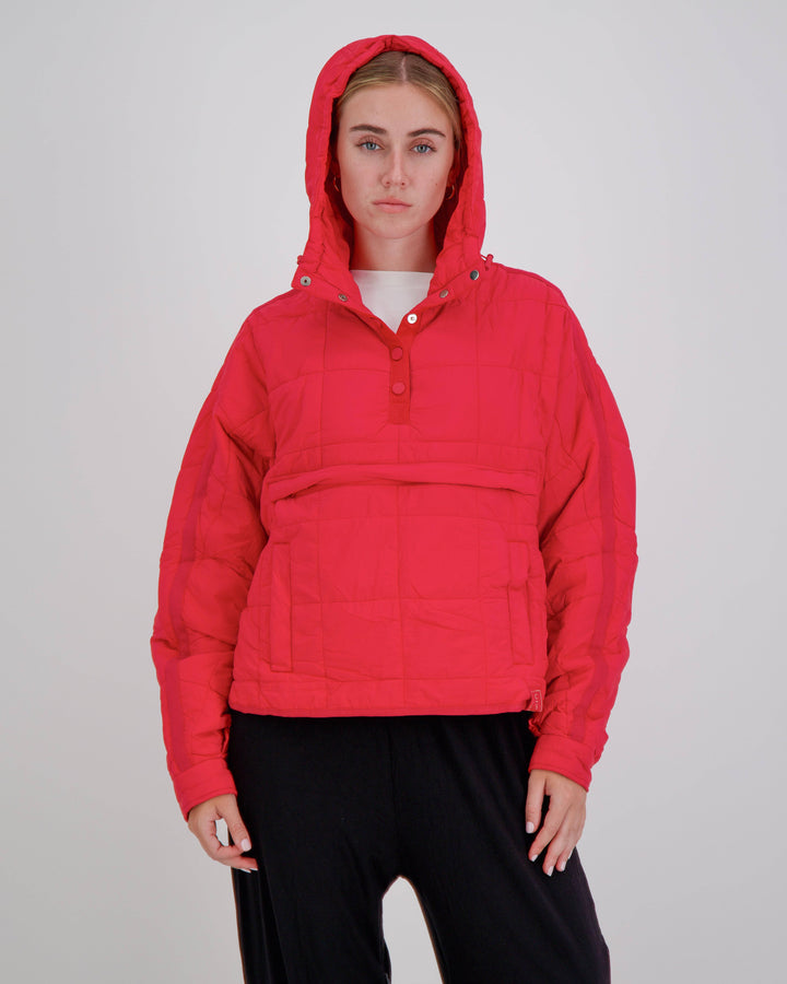 Red Elly Universal Adaptive Puffer Jacket by Christina Stephens, designed for wheelchair users with a cozy fit and functional style.