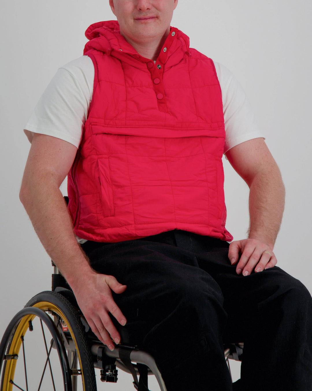 Red adaptive puffer vest by Christina Stephens, designed for wheelchair users with a gender-neutral fit and universal design.
