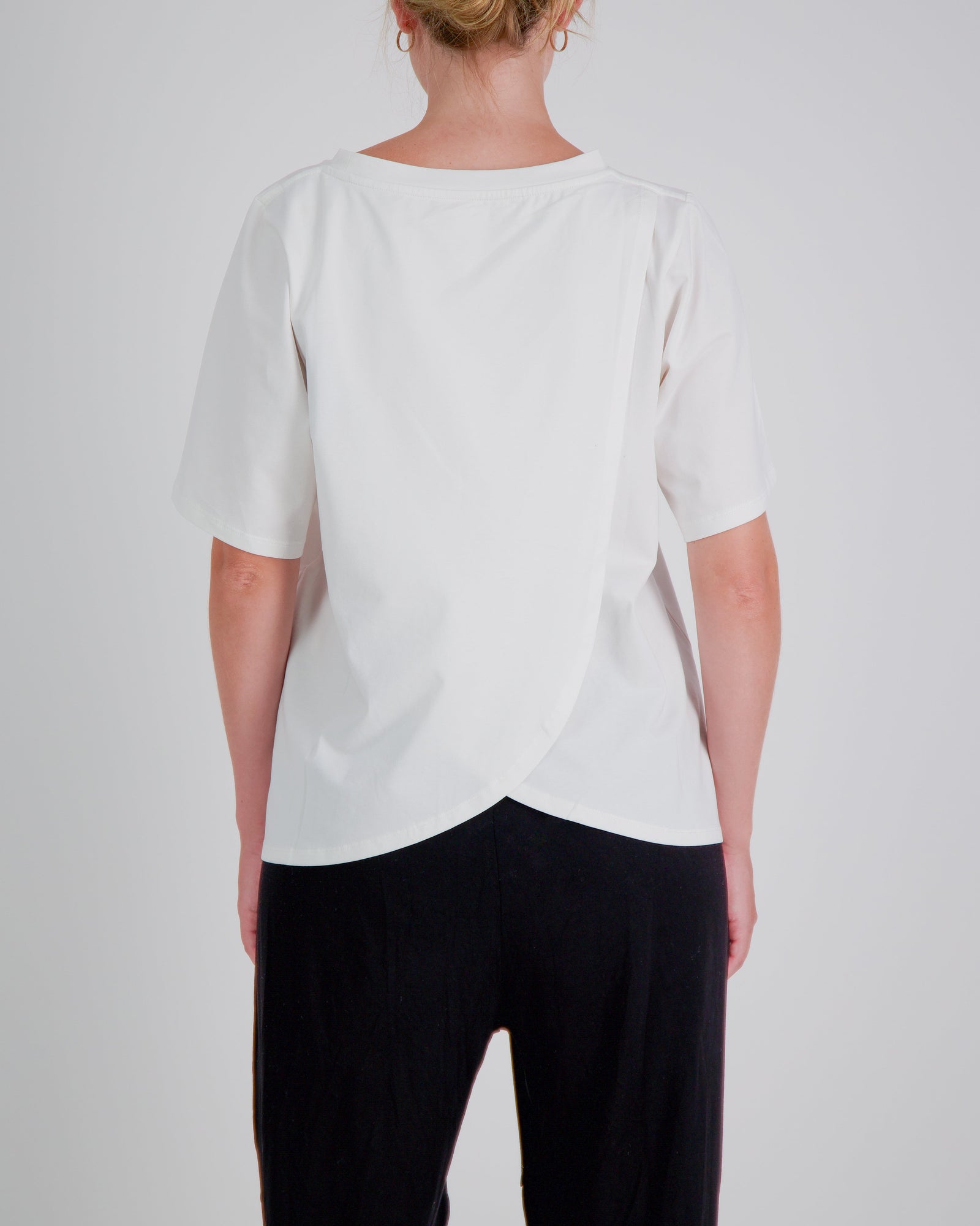 White Lilli Leaf Back T-Shirt by Christina Stephens, featuring stain-resistant fabric for enhanced dexterity support.