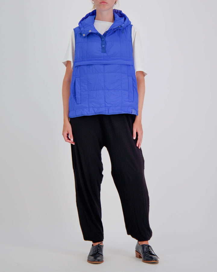 Blue adaptive puffer vest by Christina Stephens designed for wheelchair users, featuring a gender-neutral style.