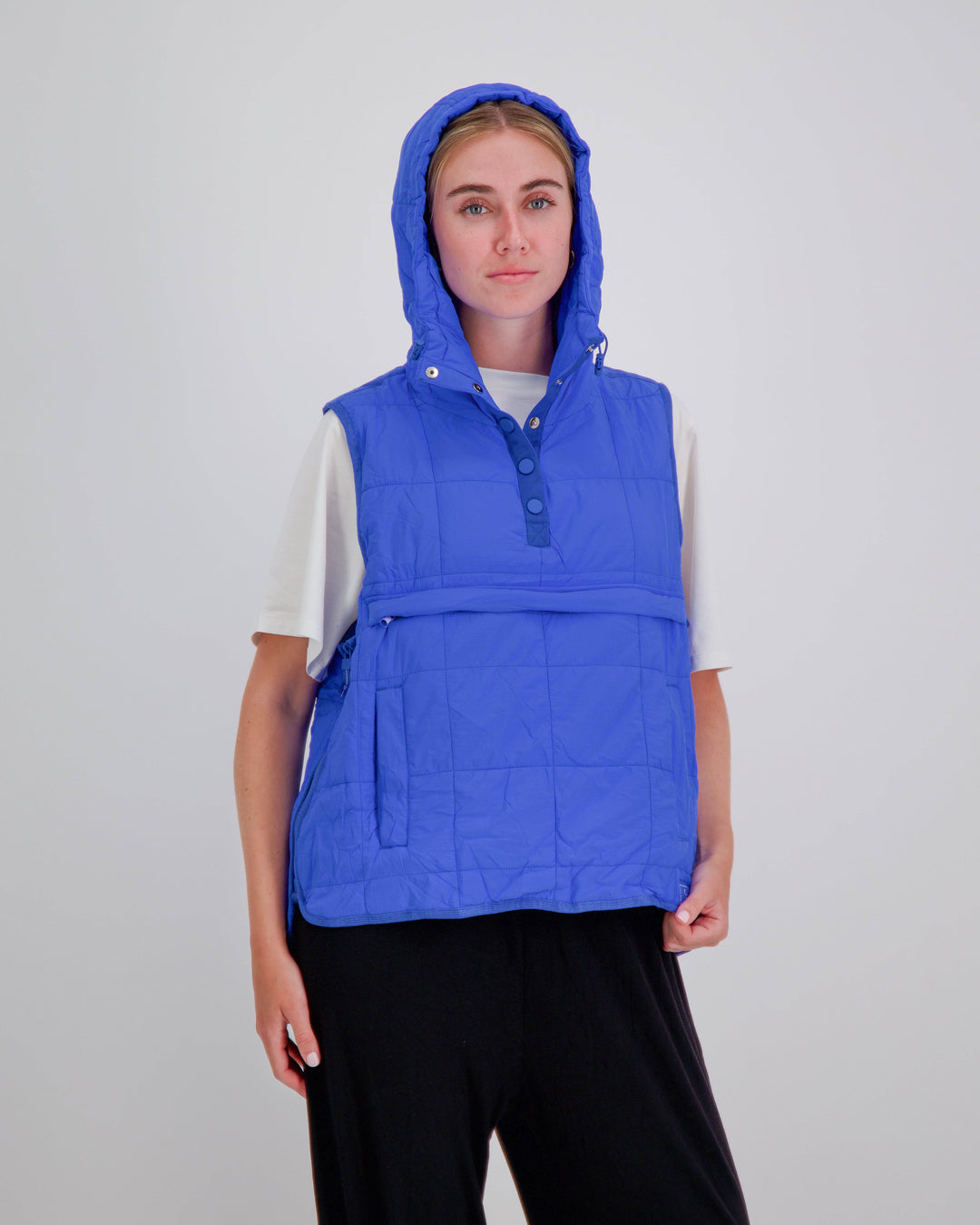 Blue adaptive puffer vest by Christina Stephens designed for wheelchair users, showcasing a gender-neutral style and universal fit.