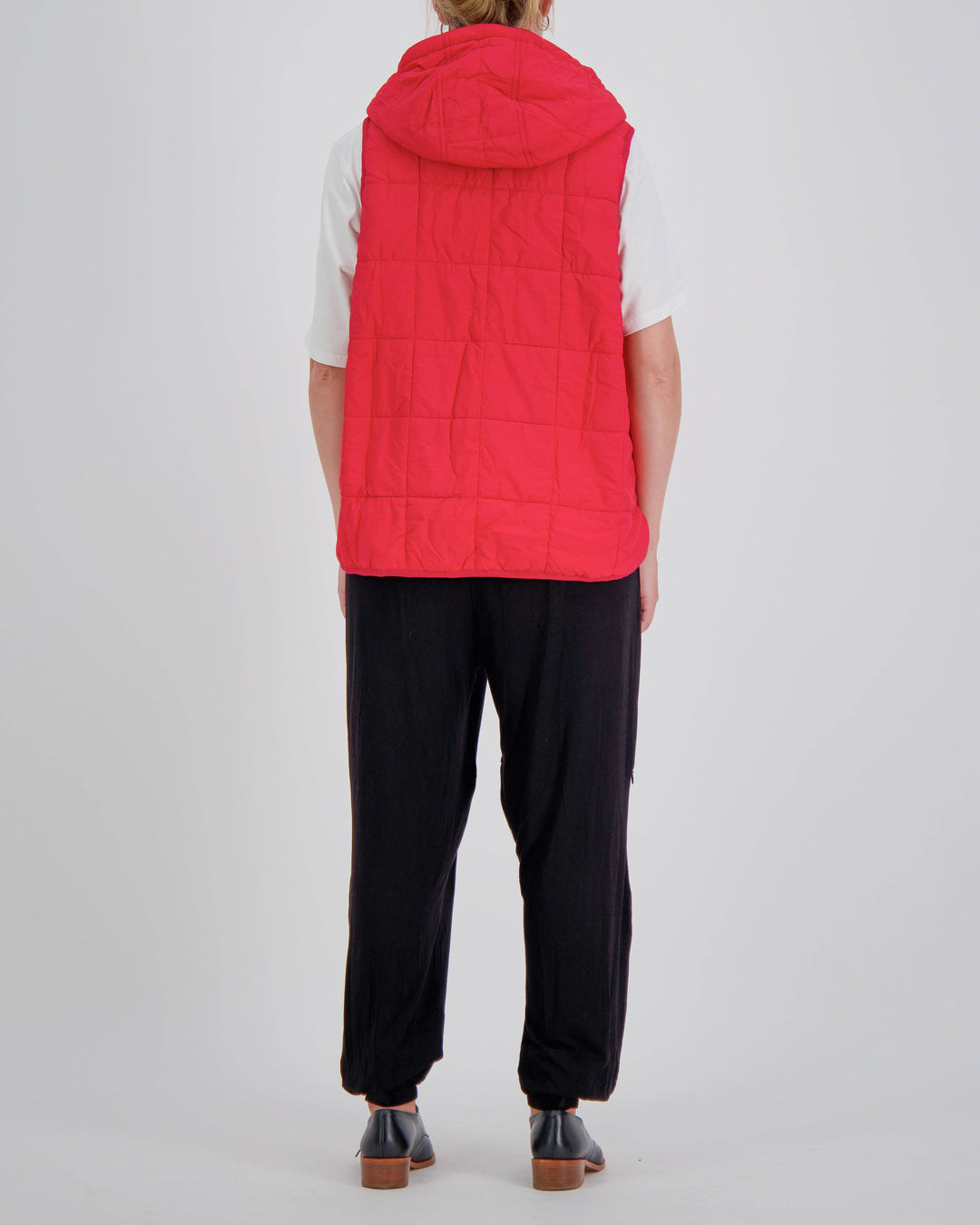 Red adaptive puffer vest by Christina Stephens designed for wheelchair users, showcasing universal design and gender-neutral style.