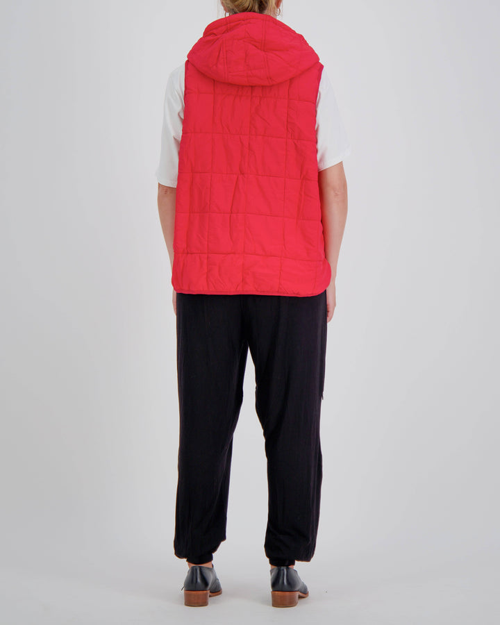 Red adaptive puffer vest by Christina Stephens designed for wheelchair users, showcasing universal design and gender-neutral style.