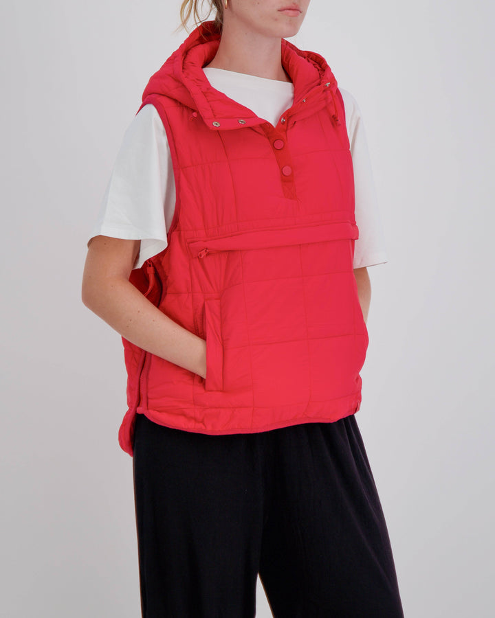 Red adaptive puffer vest by Christina Stephens designed for wheelchair users with a gender-neutral fit and universal design.