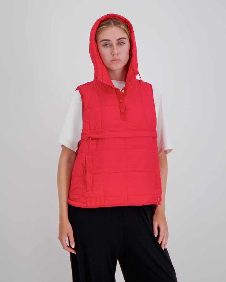 Red adaptive puffer vest by Christina Stephens, designed for wheelchair users with a gender-neutral fit.